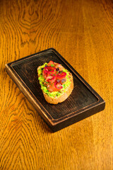 Bruschetta with avocado red fish
