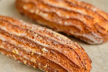Fototapeta premium Delicious French eclairs in a box