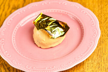 Dessert cake with gold foil