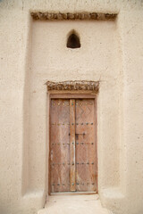 Fototapeta na wymiar old wooden doors close up in Arabian style out of focus with grain