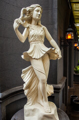 Very beautiful elegant beautiful female statue in roman style 