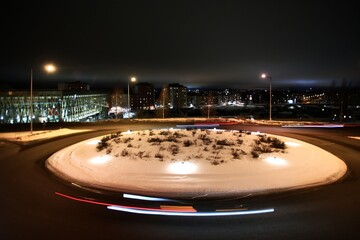 Long exposure shot of traffic circle in the winterly city of Umea in Sweden