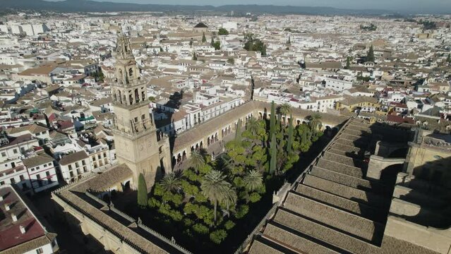 Orbiting view of Mosque-Cathedral of Cordoba and Iconic garden, Patio de los naranjos. Spain