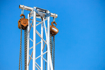 manual hoist pully wheel with metal chain at tower for lift heavy stage light structure in concert exhibition area