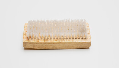 Wooden cleaning brush with nylon bristle isolated cutout on white background. Overhead view.