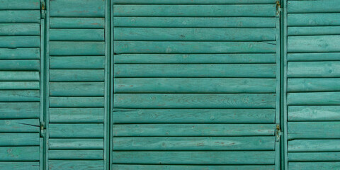 Background green classic wooden fence planks texture in wood wall wallpaper in panorama web format header