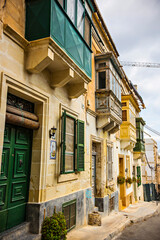 Traditional Maltese architecture. Old historical part of La Valetta with narrow streets and wooden balconies, La Valetta, Malta