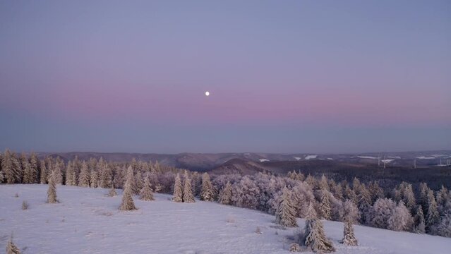 Winter drone shot with a full moon, black forest Germany 4k cinematic