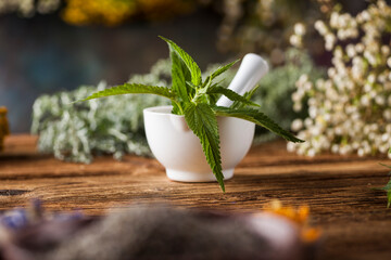 Obraz na płótnie Canvas Fresh medicinal, healing herbs on wooden