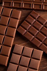 Chocolate bar, candy sweet, dessert food on wooden background