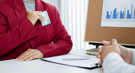 Businessmen give dollars to bribe employees in signing contracts to buy illegal land and real estate, Business fraud and social injustice, corruption and bribery concept.