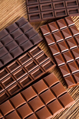 Bars Chocolate , candy sweet, dessert food on wooden background