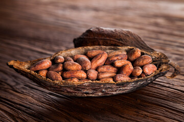 Cocoa pod on wooden background