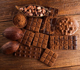 Chocolate bar, candy sweet, dessert food on wooden background