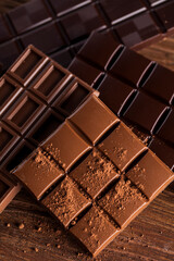 Bars Chocolate , candy sweet, dessert food on wooden background