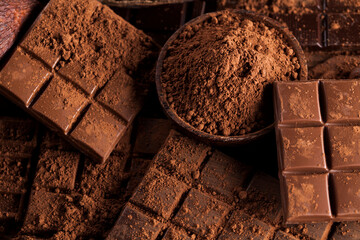 Dark and milk chocolate bar on a wooden table