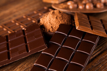 Chocolate bar, candy sweet, dessert food on wooden background
