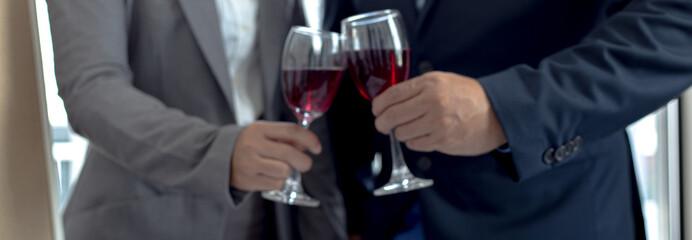 Both businessmen drink White to celebrate their financial and business success, Congratulate and celebrate concept.