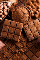 Dark and milk chocolate bar on a wooden table