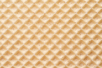 abstract relief golden waffle texture, background for your design. Sweet tasty dessert. cell texture closeup. crispy roasted wafer surface