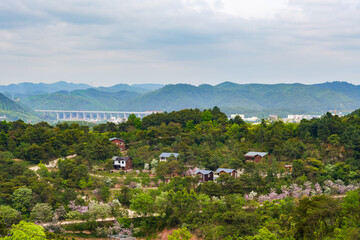 Fototapeta premium Suburban mountain landscape and distant mountains in Nanning, Guangxi, China