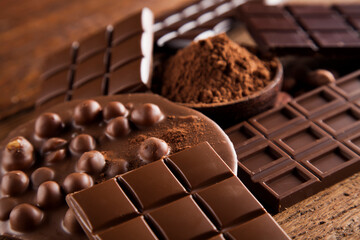 Chocolate bar, candy sweet, dessert food on wooden background