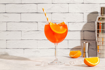 Glass of cold Aperol spritz cocktail.