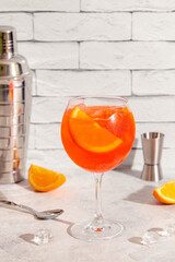 Glass of cold Aperol spritz cocktail.