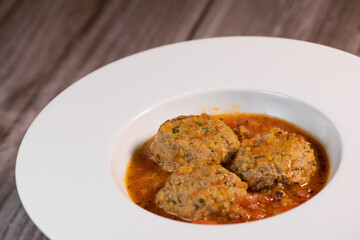 Recipe for meatballs in tomato sauce with hazelnut potatoes. High quality photo