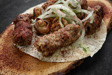 Lula kebab with grilled mushrooms