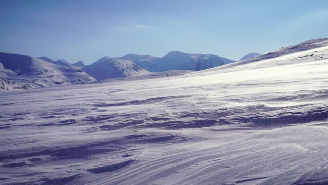 Spindrift over the snow in the mountains of Swedish Lapland.