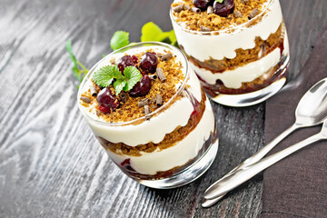 Dessert Black Forest in two glasses on dark board