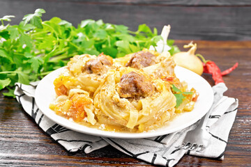 Pasta with meatballs in plate on wooden board