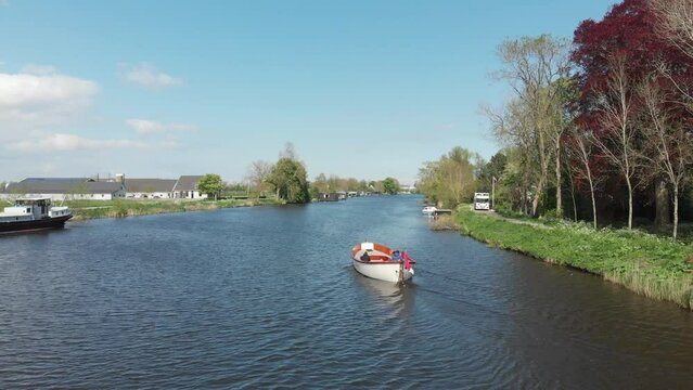 Sloop sailing on the river Vecht in Utrecht, the Netherlands (drone)