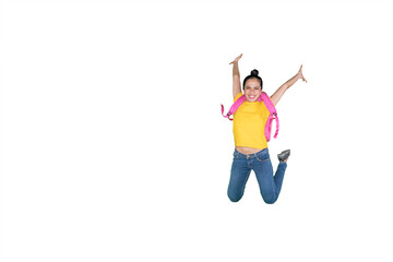 Happy female student jumping on studio