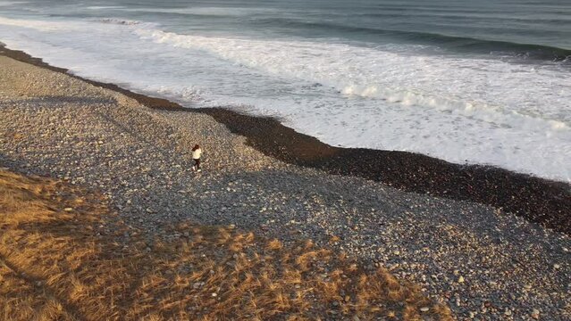 Woman Walking on Beach Aerial- Lawrencetown, Nova Scotia