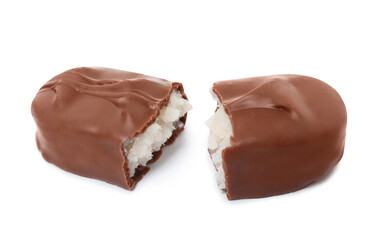 Halves of delicious milk chocolate candy bar with coconut filling on white background