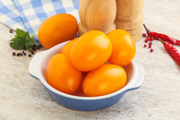 Sweet ripe yellow tomato in the bowl