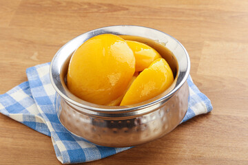 Sweet canned peaches with syrope