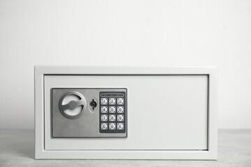 Steel safe with electronic lock on white background
