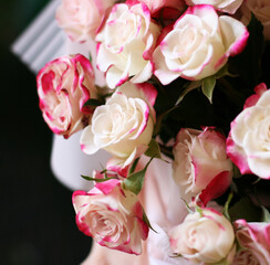 Thriving of full bloom flowerscape, floral visual of live flowers wall, beautiful roses background. Front top photo of a pink roses with selective focus in a bouquet on a soft green background 