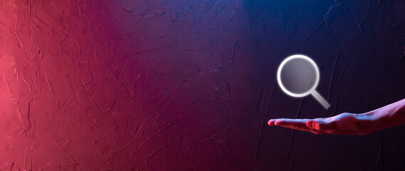 Businessman, man hold in hand magnifying glass icon.business, technology and internet concept