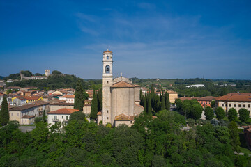 Fototapeta na wymiar Church San Michele Church in Monzambano in Italy in a historic town. Historic churches of Italy drone view. aerial view of the italian church by the river.