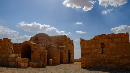 Beautiful view of Quseir Amra in Jordan against a blue cloudy sky