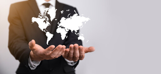 Holding a glowing earth globe social network in the hands of businessmen.World map icon,symbol
