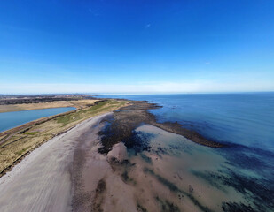Aerial view of the incredible sea and beach on the east coast of Scotland