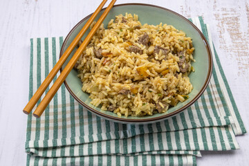 top view of beef fried rice in a plate on a table