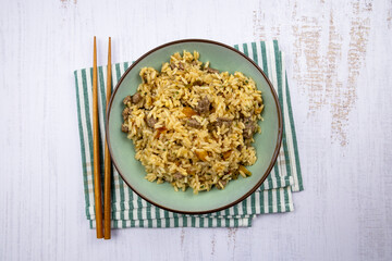 top view of beef fried rice in a plate on a table