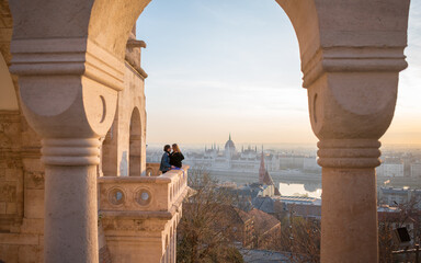 Fototapeta premium Romantic couple on the Parliament balcony in the city of Budapest, Hungary