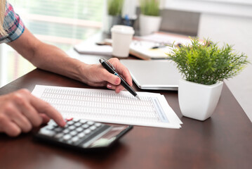 Female hands making calculation